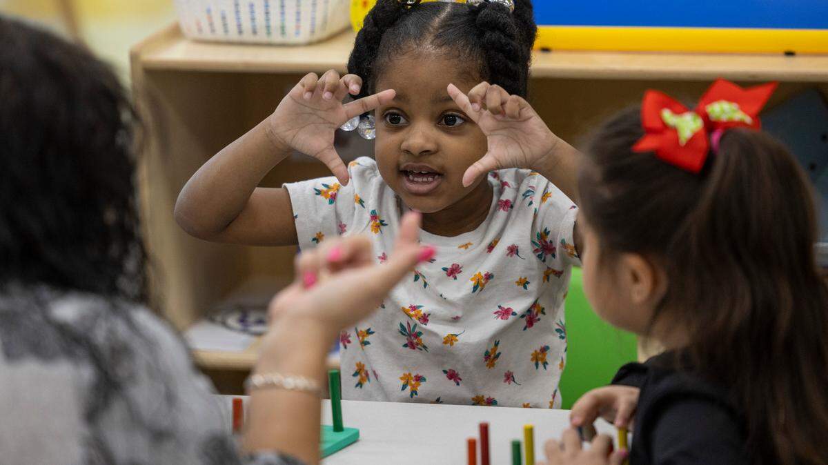 Pre-schooler Harmony Tuck, center, practices counting with Xiomara De Jesus-Candelaria, left, at the Early Learning Center at Memory Road, Thursday, Nov. 30, 2023. The Center is Wake County’s first standalone Pre-K center with space for up to 132 students.