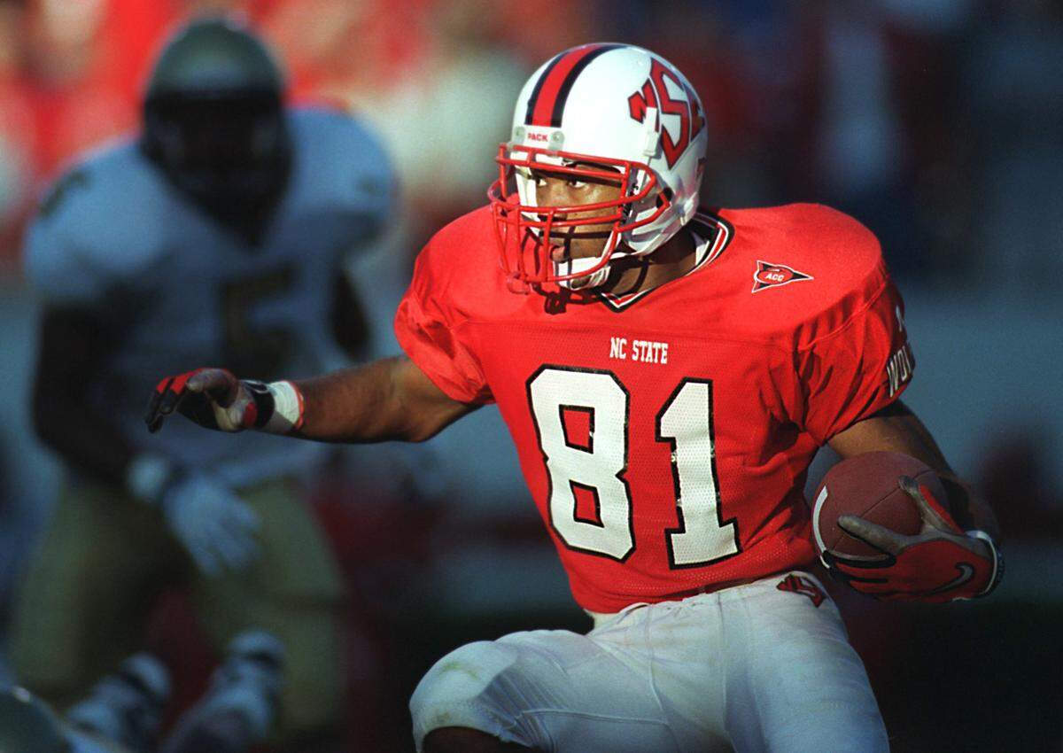 Torry Holt, shown during his N.C. State playing days in 1998, later starred for the St. Louis Rams and their “Greatest Show on Turf” offense. He had eight straight 1,000-yard receiving seasons in the NFL.