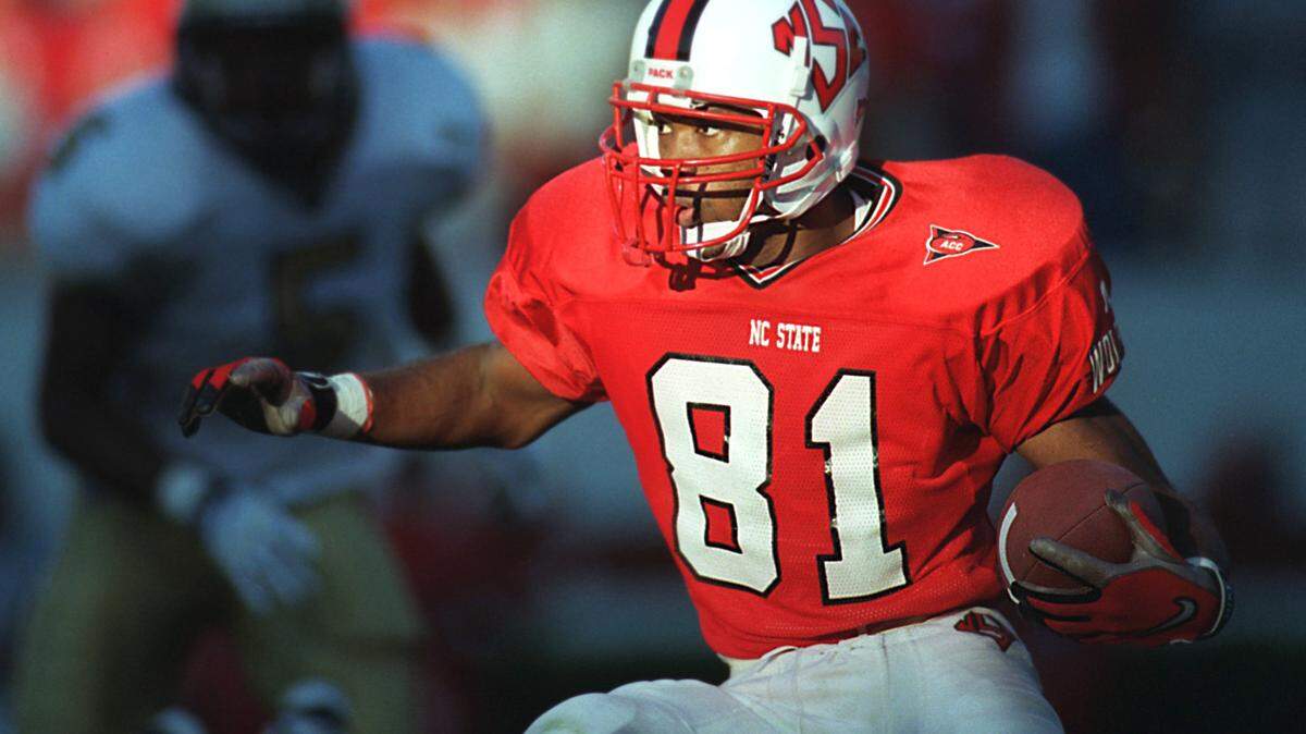 NCSU ‘s Torry Holt runs back a long punt return late in the game against Georgia Tech in a game in 1998.