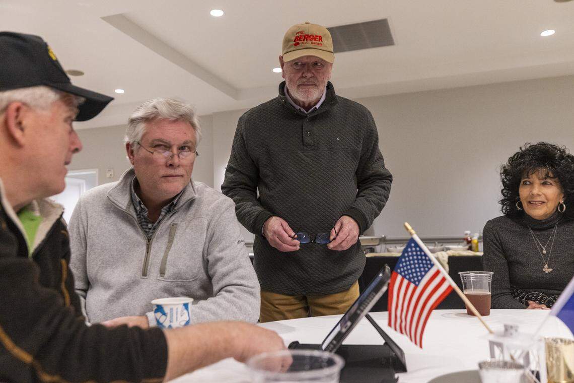N.C. Sen. Phil Berger, an Eden Republican and the most powerful state lawmaker, center, checks early election results with supporters during a primary election night watch party in Reidsville, in Rockingham County on Tuesday, March 3, 2026. Berger is running against Rockingham County Sheriff Sam Page. The district also includes part of Guilford County.