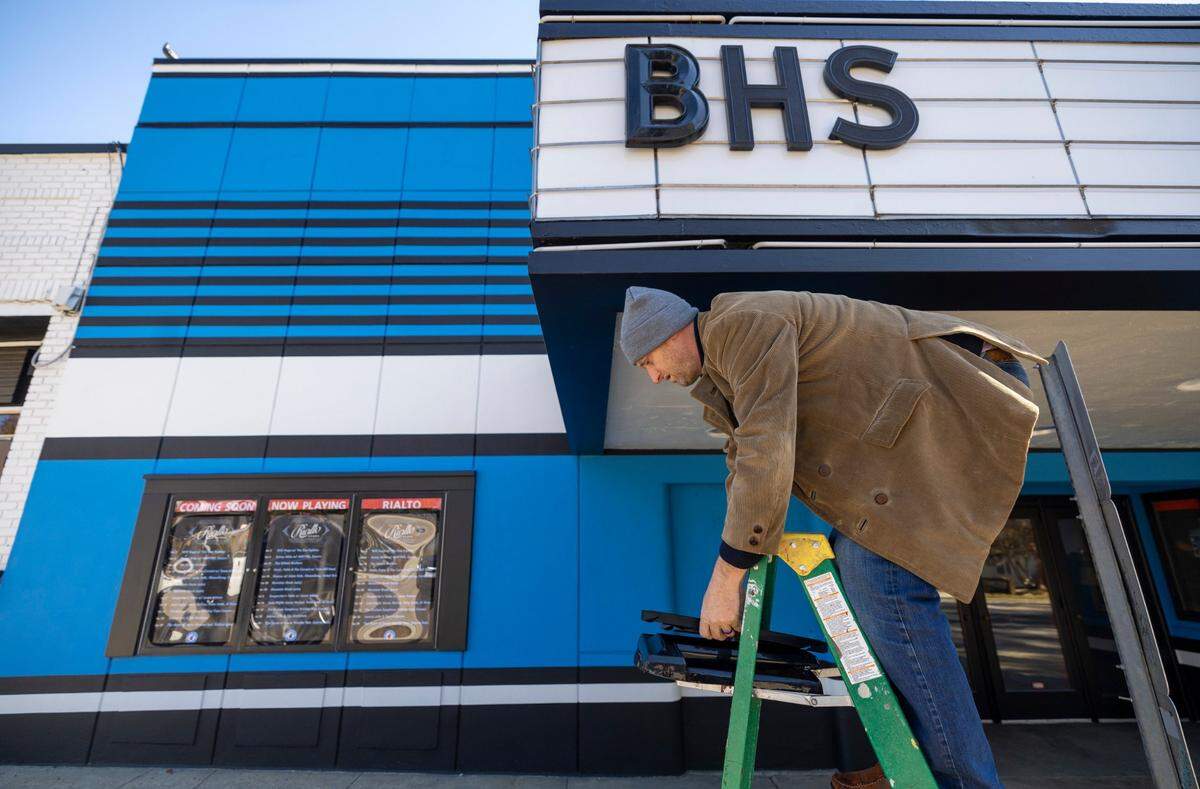 Rialto Theatre manager Hayes Permar changes the marquee at the historic theatre on Glenwood Avenue on Wednesday, November 1, 2023 in Raleigh, N.C.