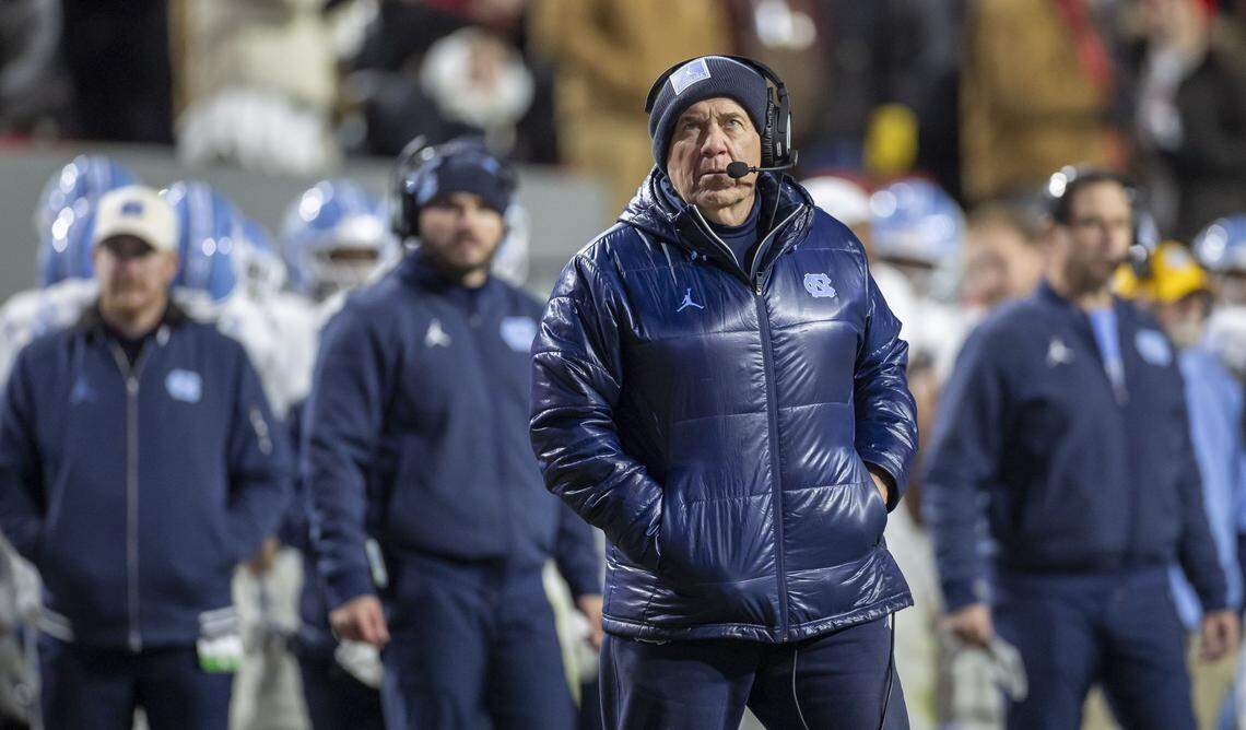 North Carolina coach Bill Belichick watches a replay of an N.C. State touchdown in the second quarter on Saturday, November 29, 2025 at Carter-Finley Stadium in Raleigh, N.C.