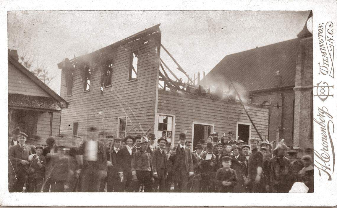A postcard showing the destruction of the Manly printing press in Wilmington in 1898. The building housed The Daily Record, a newspaper operated by Black editor Alex Manly, a frequent target of the white supremacist campaign.