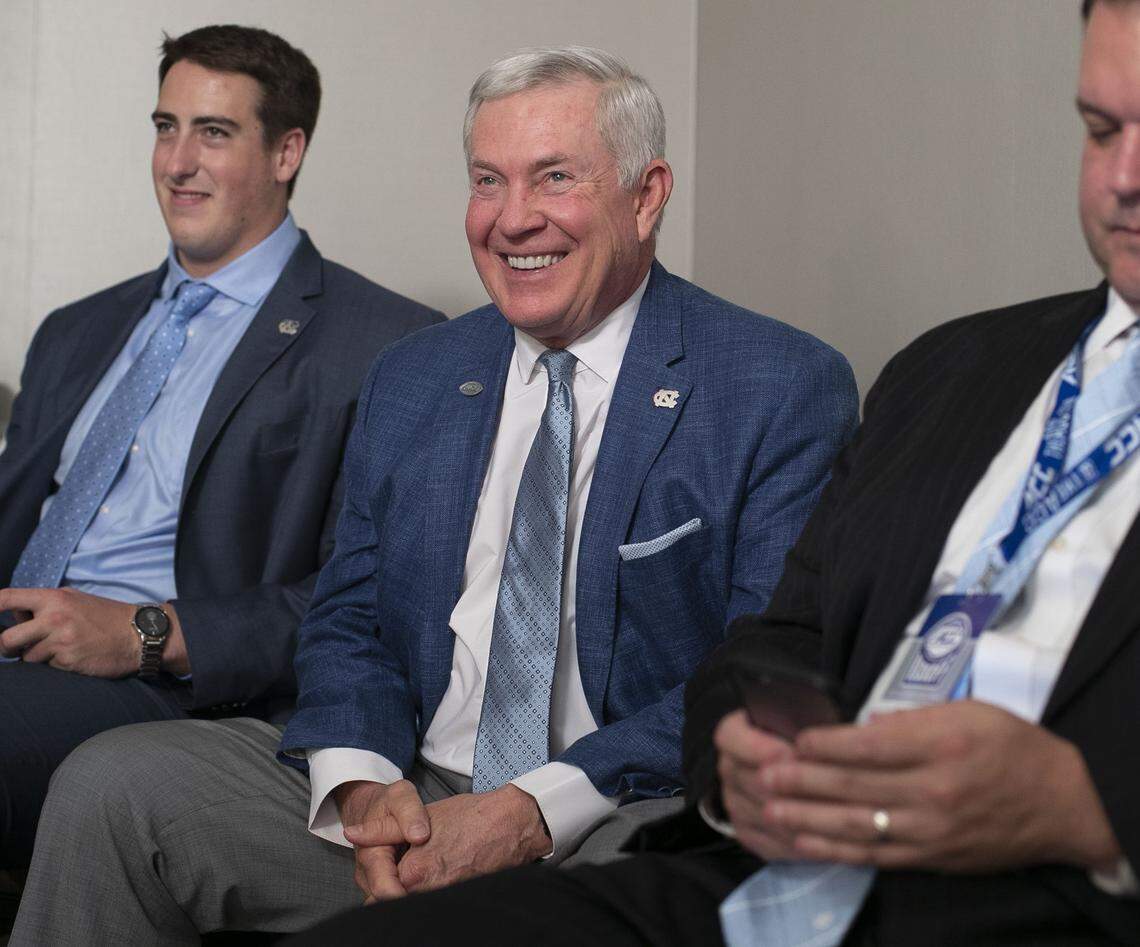 North Carolina coach Mack Brown laughs as he watches safety Myles Dorn during an interview on Thursday morning July 18, 2019 during the ACC Kickoff at the Westin in Charlotte, N.C.
