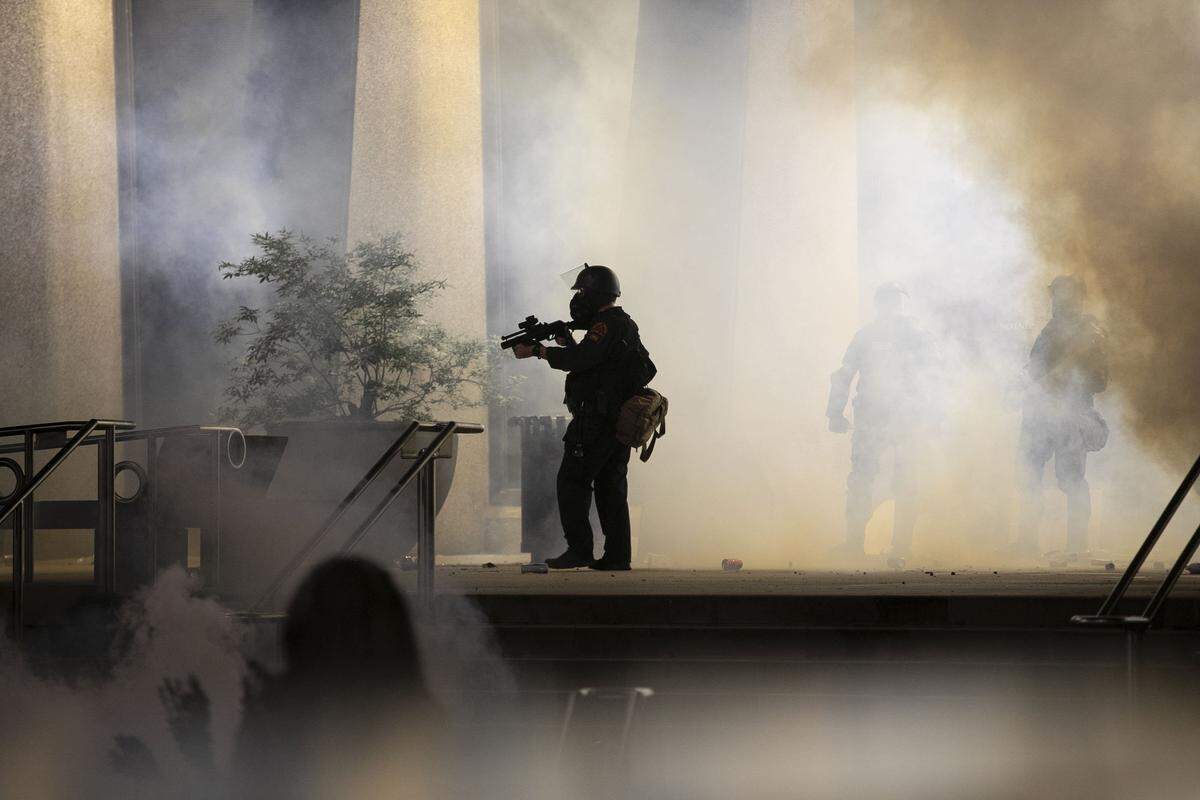 Raleigh Police and law enforcement protect the Wake County Courthouse on Fayetteville Street during a night of unrest, destruction and looting on Saturday, May 30, 2020 in Raleigh, N.C. The demonstrations and protest were in reaction to George Floyd’s death earlier this week in Minneapolis, MN.