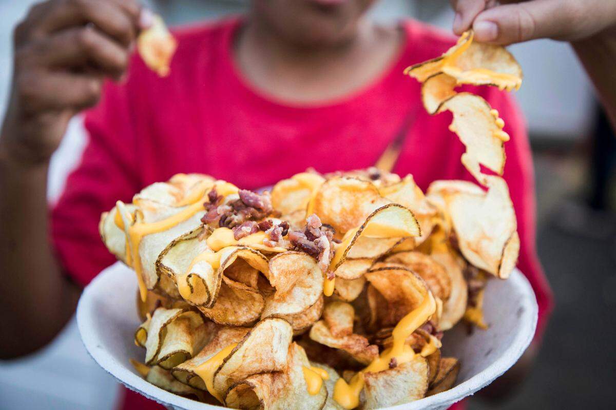 The family-owned Tater Hut serves fresh-cut french fries at the N.C. State Fair in several forms, a popular form being the ribbon fries.  