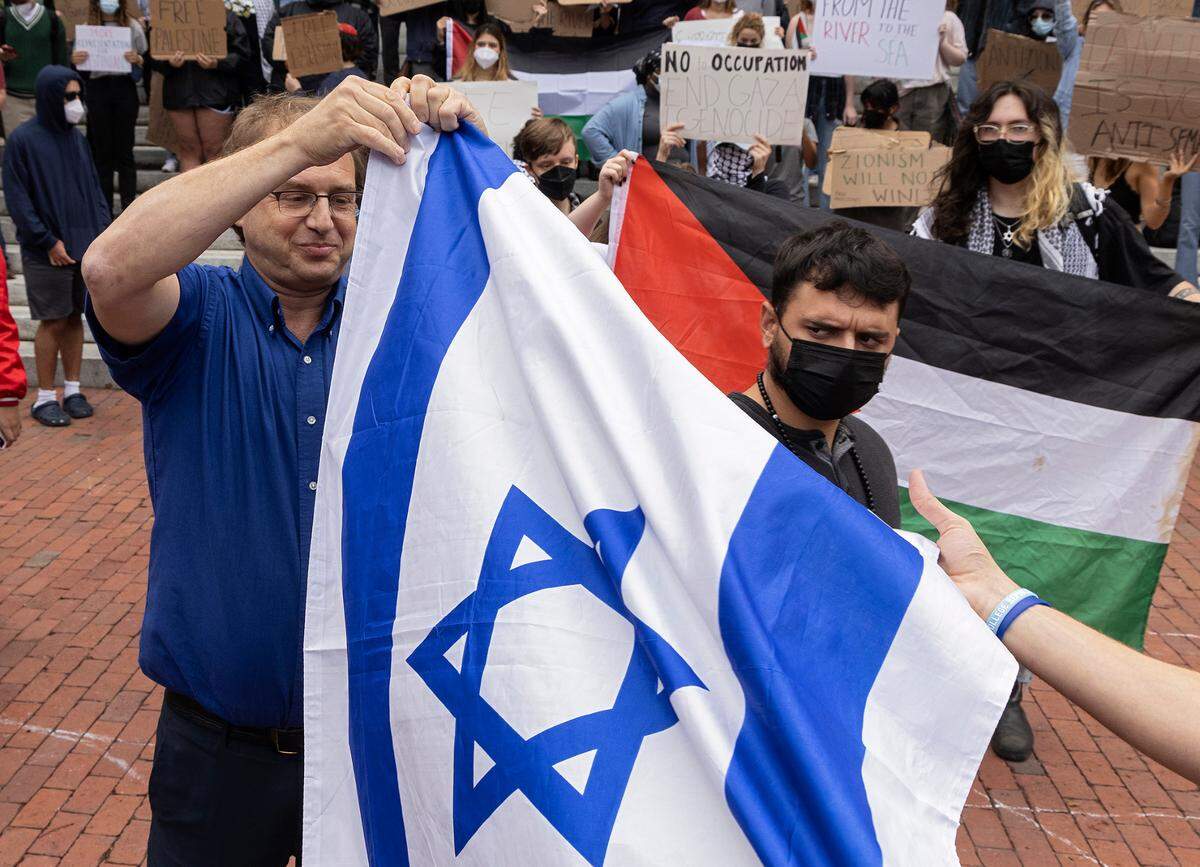 Counter-protesters and Pro-Palestinian demonstrators interact during a rally in support of Palestinians at UNC-Chapel Hill on Thursday, Oct. 12, 2023. The rally was organized by the UNC chapter of Students for Justice in Palestine.