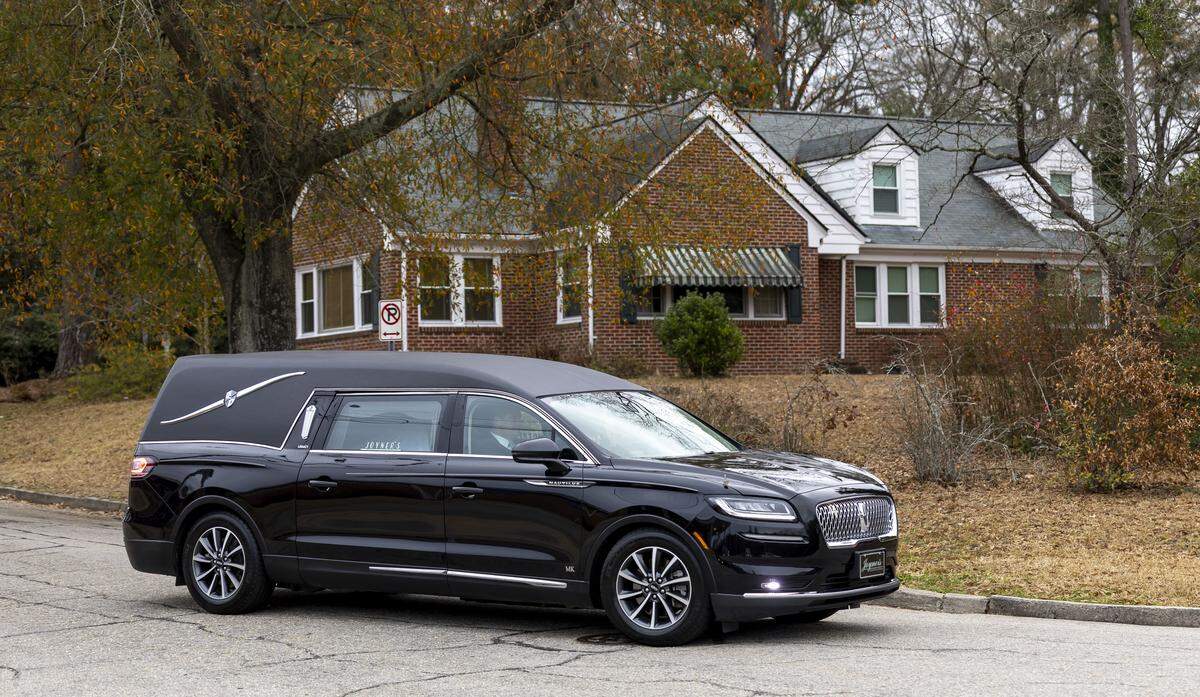 The hearse bearing the casket of former North Carolina Gov. Jim Hunt departs First Presbyterian Church, en route to a private burial on Friday, Dec. 26, 2025, in Wilson.