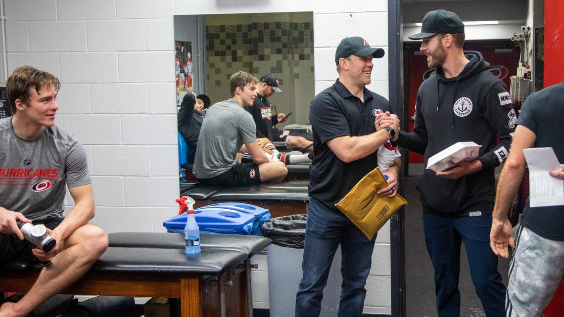Emergency goalie Dave Ayres, 42, center, meets with Carolina Hurricanes players and staff Tuesday, Feb. 25, 2020 while visiting Raleigh after helping the Hurricanes beat the Maple Leafs in Toronto.