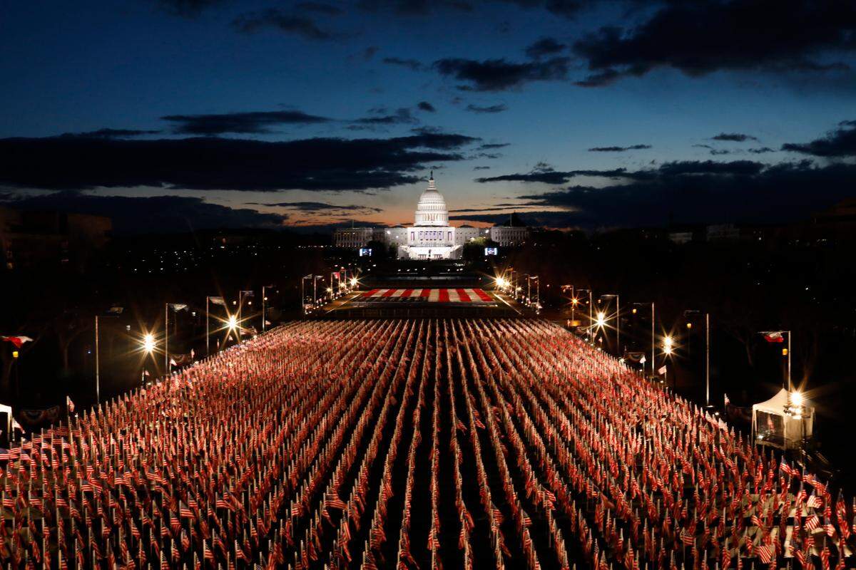 Flags representing people unable to attend the presidential inauguration of Joe Biden on the National Mall in Washington early on Wednesday morning, Jan. 20, 2021, hours before the ceremony.