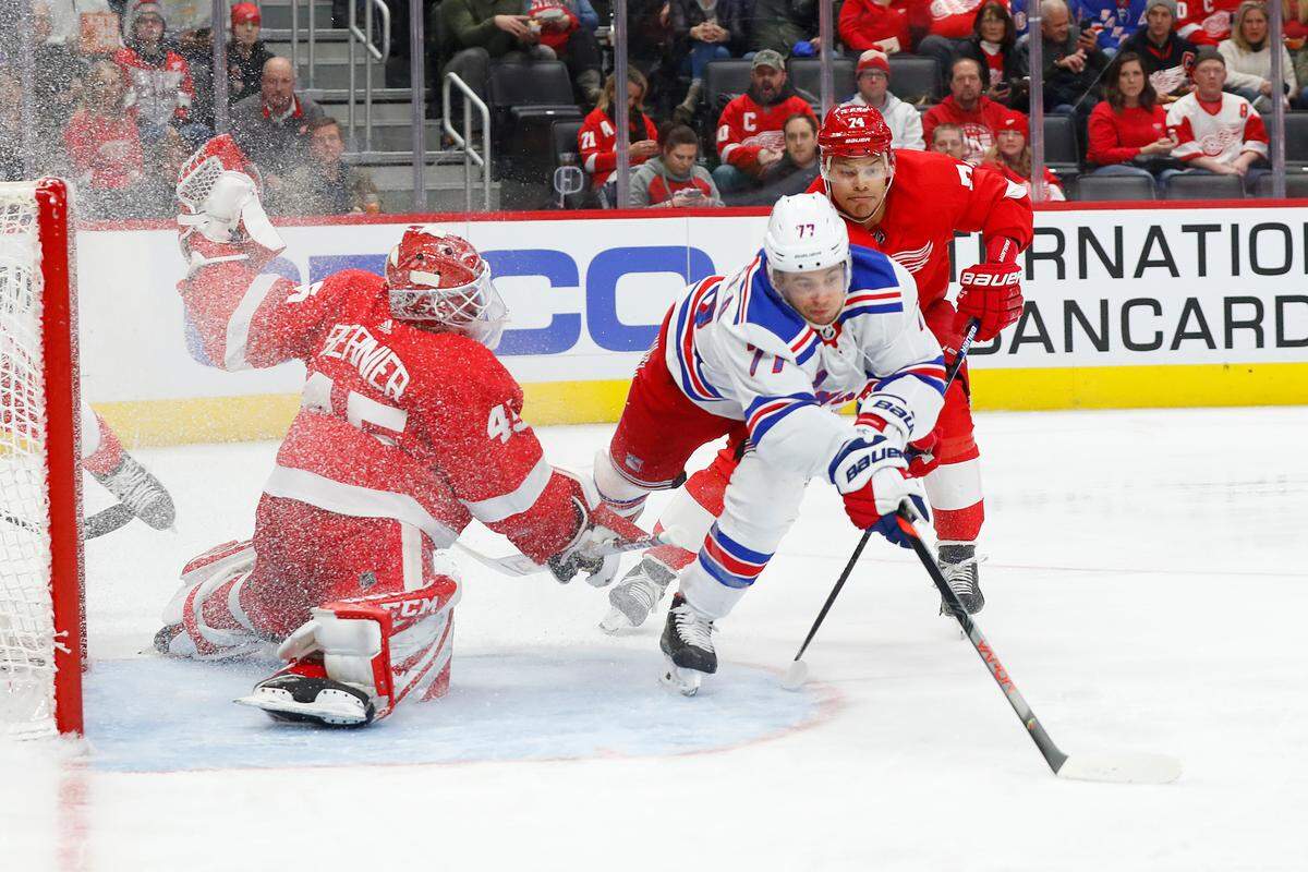 Detroit Red Wings goaltender Jonathan Bernier (45) stops a shot by New York Rangers’ Tony DeAngelo (77) as Madison Bowey (74) defends during the third period of an NHL hockey game Saturday, Feb. 1, 2020, in Detroit. (AP Photo/Paul Sancya)
