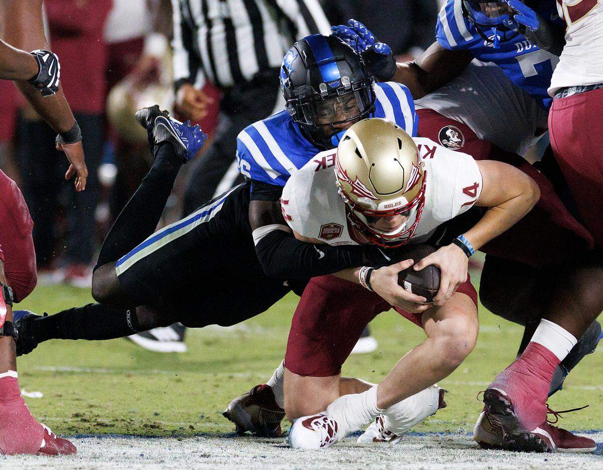 Duke’s Joshua Pickett sacks Florida State quarterback Luke Kromenhoek during the first half of the Blue Devils’ game on Friday, Oct. 18, 2024, at Wallace Wade Stadium in Durham, N.C.