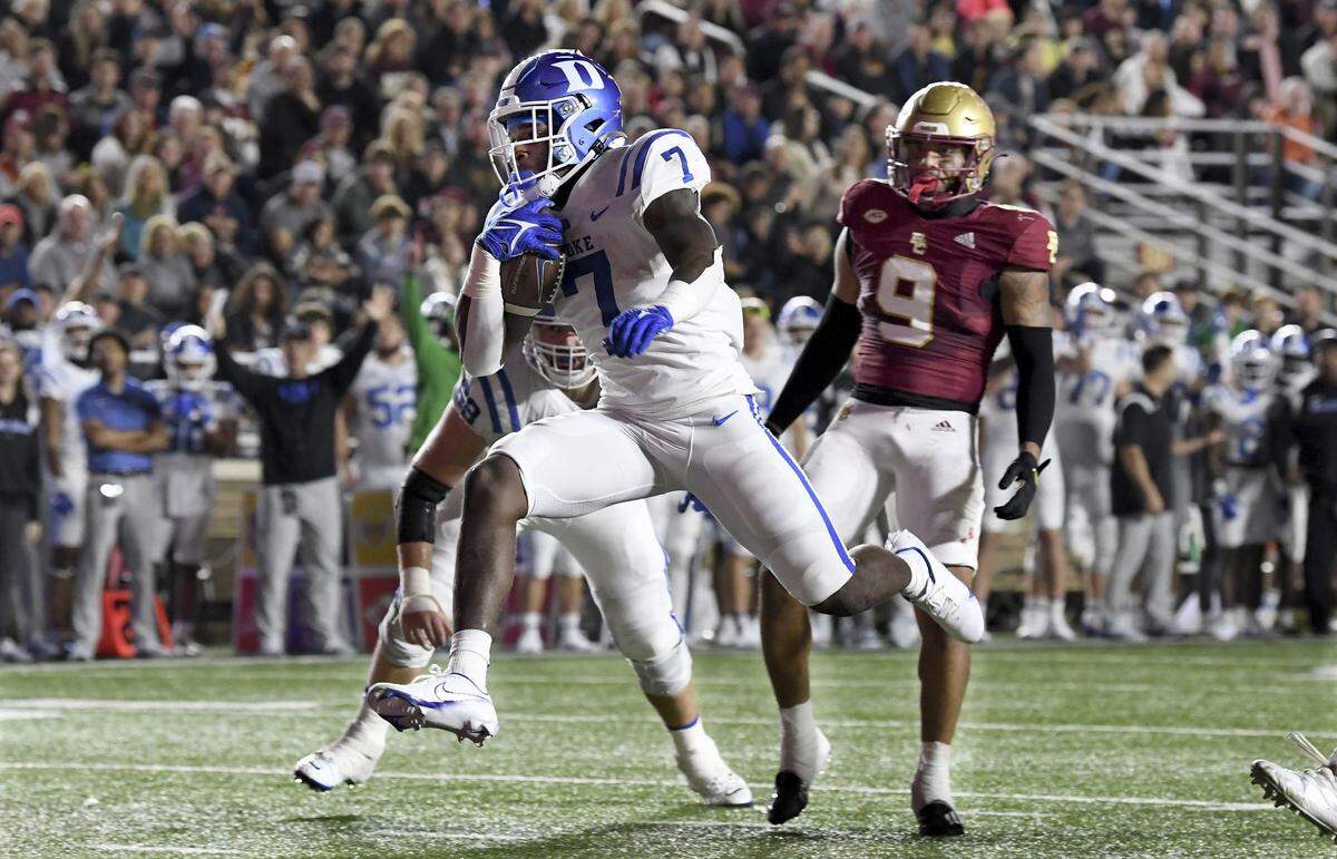 Duke runingback Jordan Waters (7) runs into the end zone to score during the first half of an NCAA college football game, Friday, Nov. 4, 2022 in Boston. (AP Photo/Mark Stockwell)