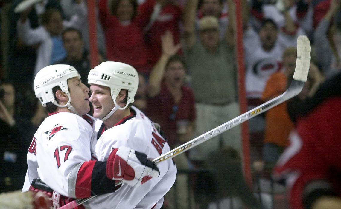 Carolina Hurricanes Rod Brind'Amour, left, and Bates Battaglia celebrate Brind'Amour's goal in the first game of the Stanley Cup playoffs in April 2002.