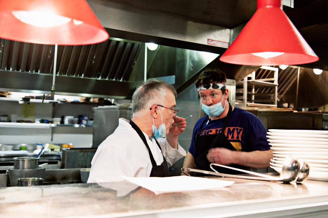 Chef Shane Ingram, left, tastes a dish as sous chef Jeff Crane looks on in the kitchen at The Durham on Thursday, Feb. 24, 2022.