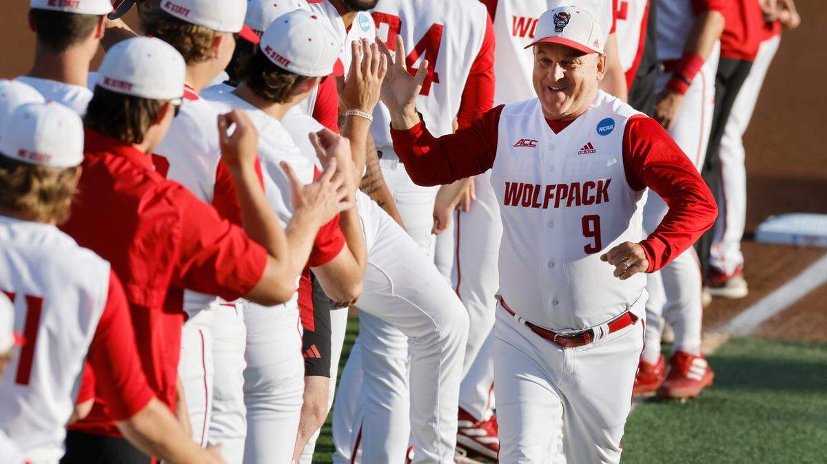 N.C. State head coach Elliott Avent greets his players during team introductions before N.C. State’s game against Bryant in the NCAA Raleigh Regional at Doak Field Friday, May 31, 2024. N.C. State head coach Elliott Avent greets his players during team introductions before N.C. State’s game against Bryant in the NCAA Raleigh Regional at Doak Field Friday, May 31, 2024.