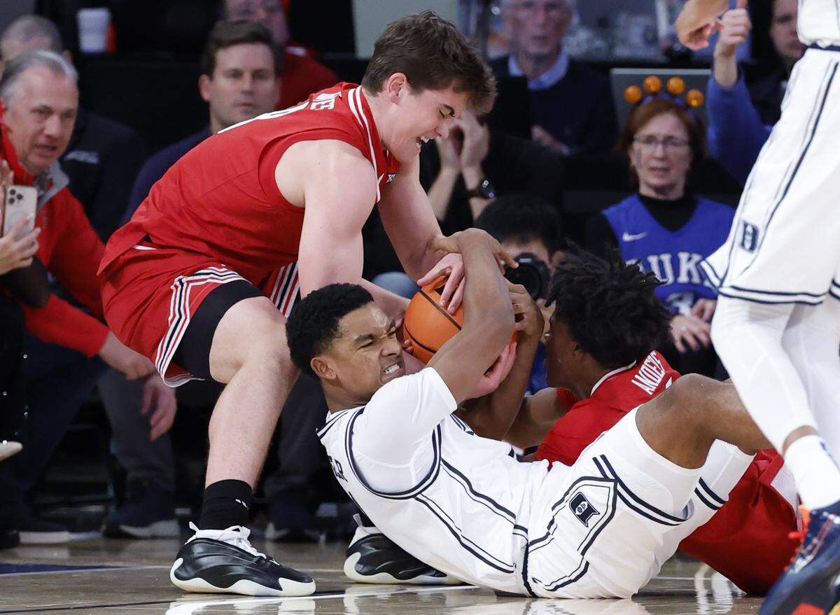 Texas Tech's Nolan Groves takes the ball from Duke’s Caleb Foster during the second half of Texas Tech’s 82-81 victory over Duke in the SentinelOne Classic at Madison Square Garden in New York City on Saturday, Dec. 20, 2025.
