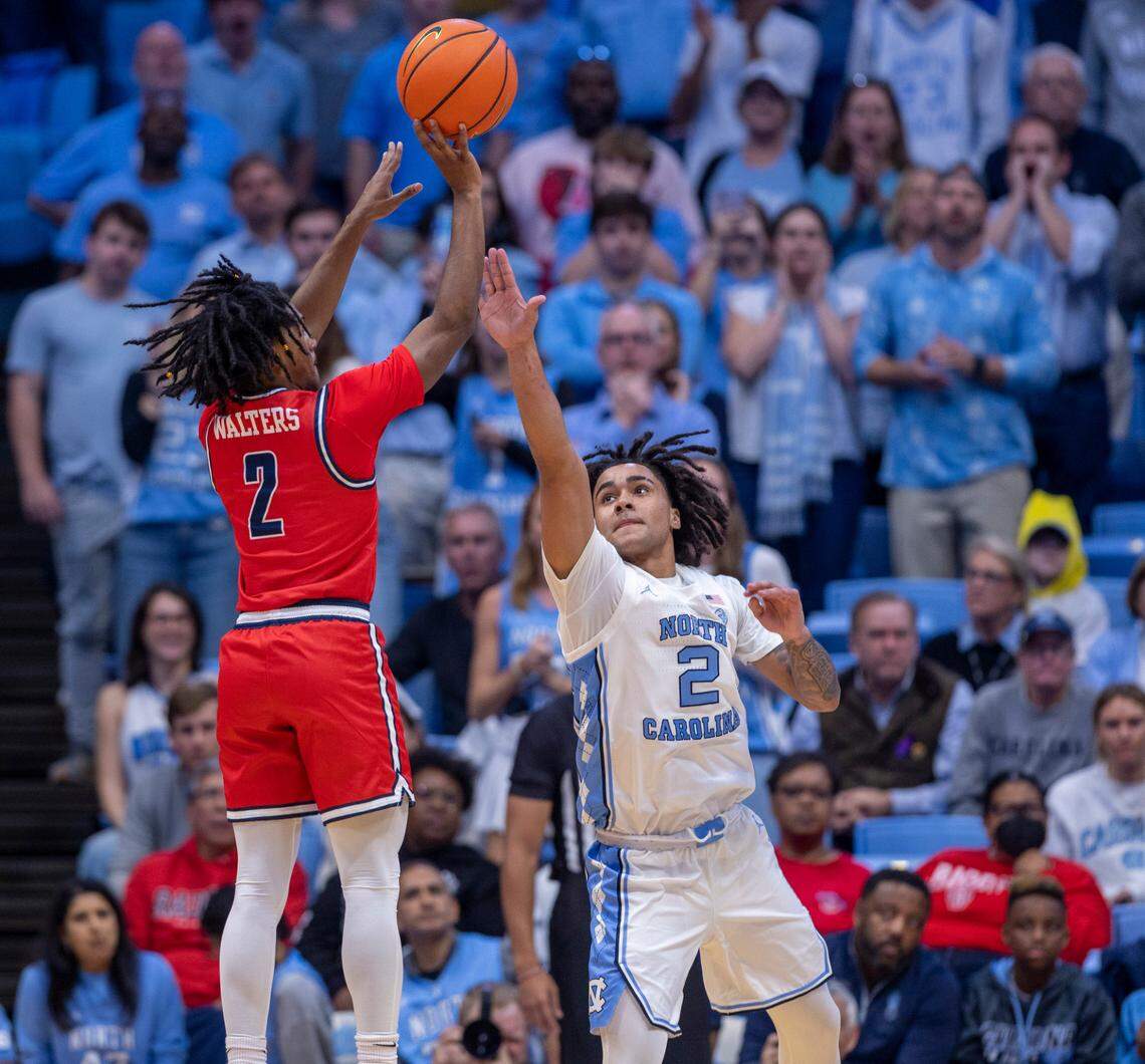 North Carolina’s Elliott Cadeau (2) defends Radford’s Trenton Walters (2) in the second half on Monday, November 6, 2023 at the Dean Smith Center in Chapel Hill, N.C.