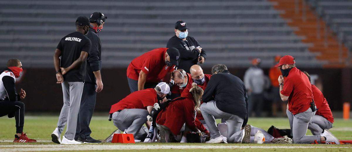 Medical staff attend to N.C. State’s Khalid Martin during the Wolfpack’s game against Virginia Tech at Lane Stadium in Blacksburg, VA Saturday, Sept. 26, 2020.