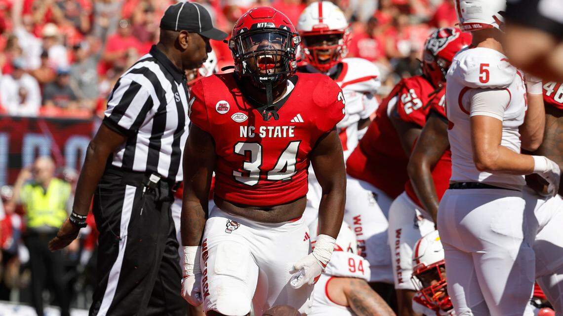 N.C. State running back Delbert Mimms III (34) celebrates after scoring on a one-yard touchdown run during the first half of N.C. State’s game against VMI at Carter-Finley Stadium in Raleigh, N.C., Saturday, Sept. 16, 2023.