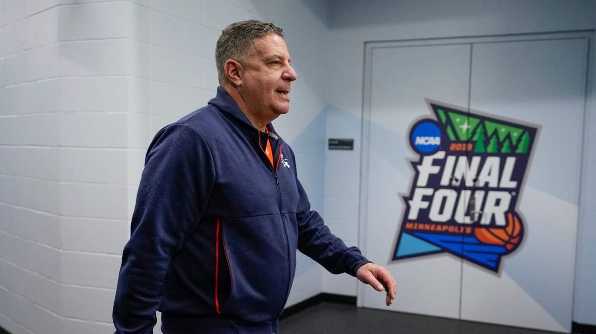 Auburn head coach Bruce Pearl walks to a news conference after a practice session for the semifinals of the Final Four NCAA college basketball tournament, Thursday, April 4, 2019, in Minneapolis.