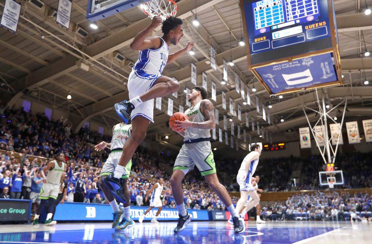 Duke’s Sean Stewart (13) celebrates after slamming in two during Duke’s 106-69 victory over Queens University at Cameron Indoor Stadium in Durham, N.C., Saturday, Dec. 30, 2023.