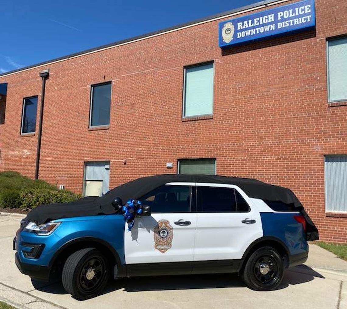 The Raleigh Police Department established this memorial, a police car draped in black, in honor of Officer Gabriel Torres. Torres, 29, was one of five killed in a mass shooting Oct. 13, 2022, in northeast Raleigh.