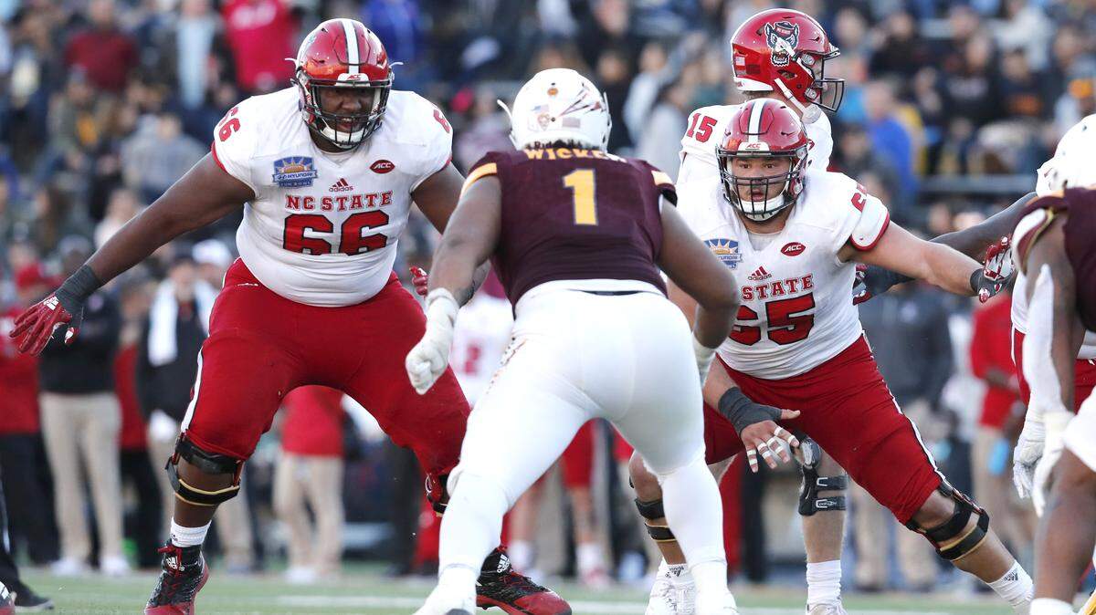 N.C. State’s Joshua Fedd-Jackson (66), left, and Garrett Bradbury (65) block Arizona State defensive lineman JoJo Wicker (1) during the second half of N.C. State’s 52-31 victory over Arizona State in the Hyundai Sun Bowl at Sun Bowl Stadium in El Paso, TX Friday, Dec. 29, 2017.