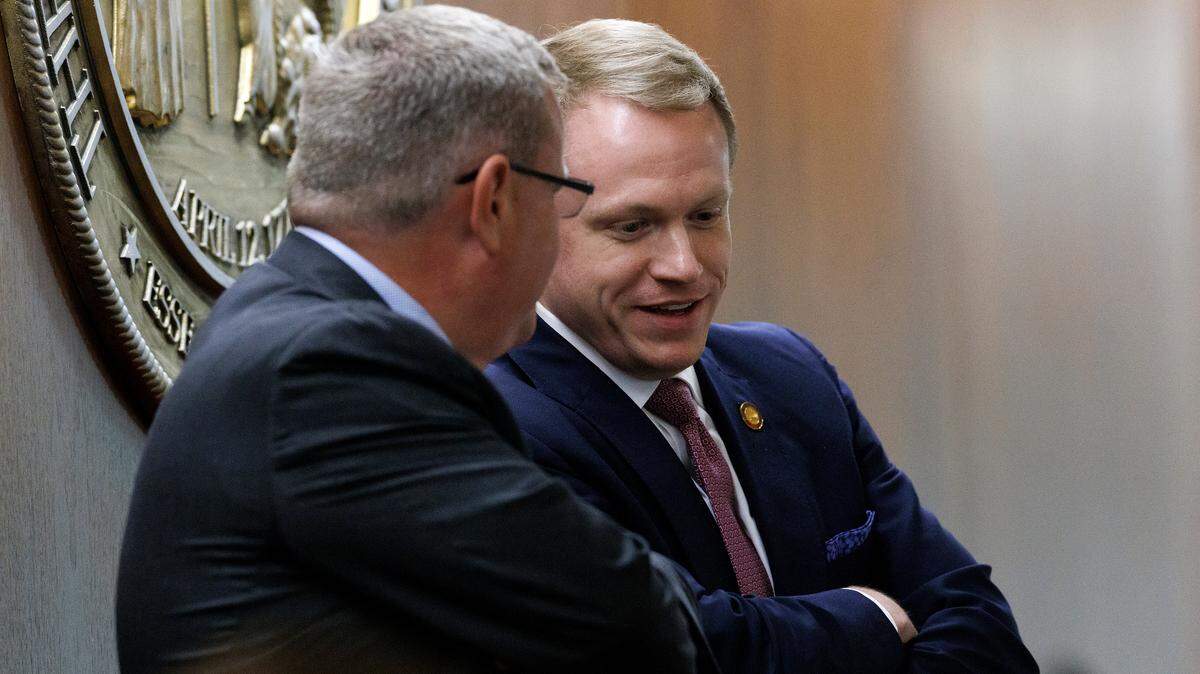 House Speaker Tim Moore speaks with House Speaker-Designate Destin Hall during debate on a bill at the General Assembly on Tuesday, Nov. 19, 2024, in Raleigh, N.C.