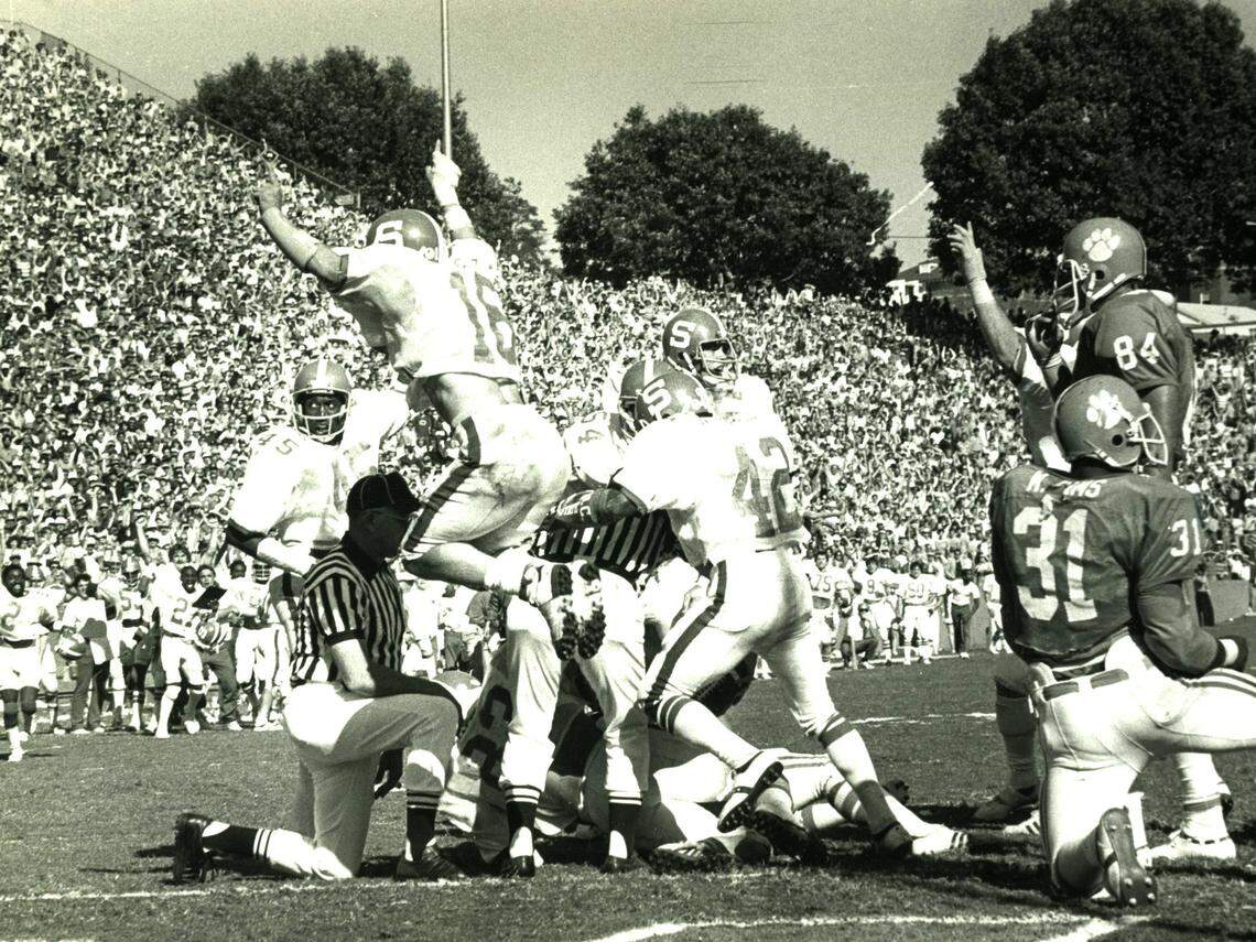 N.C. State’s Mike Nall celebrates as the Wolfpack makes a goal-line stand against Clemson in 1979.