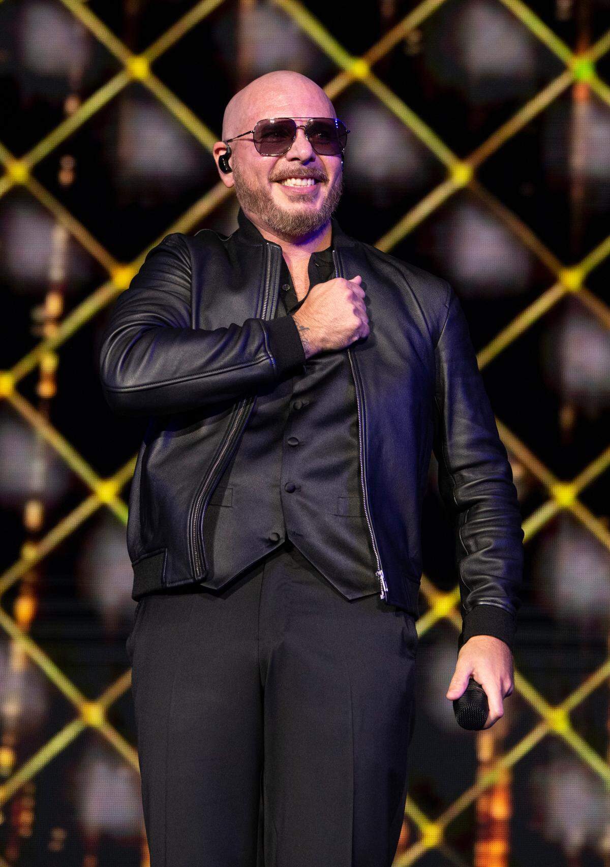 Pitbull reacts to the screaming crowd at Coastal Credit Union Music Pavilion at Walnut Creek in Raleigh, N.C., Thursday night, July 28, 2022.