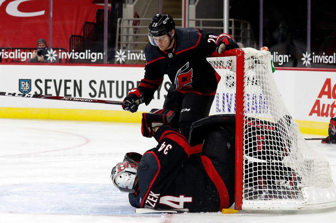Carolina Hurricanes’ Max McCormick (28) collides with goaltender Petr Mrazek (34) causing and injury to Mrazek during the first period of an NHL hockey game against the Dallas Stars in Raleigh, N.C., Saturday, Jan. 30, 2021. (AP Photo/Karl B DeBlaker)
