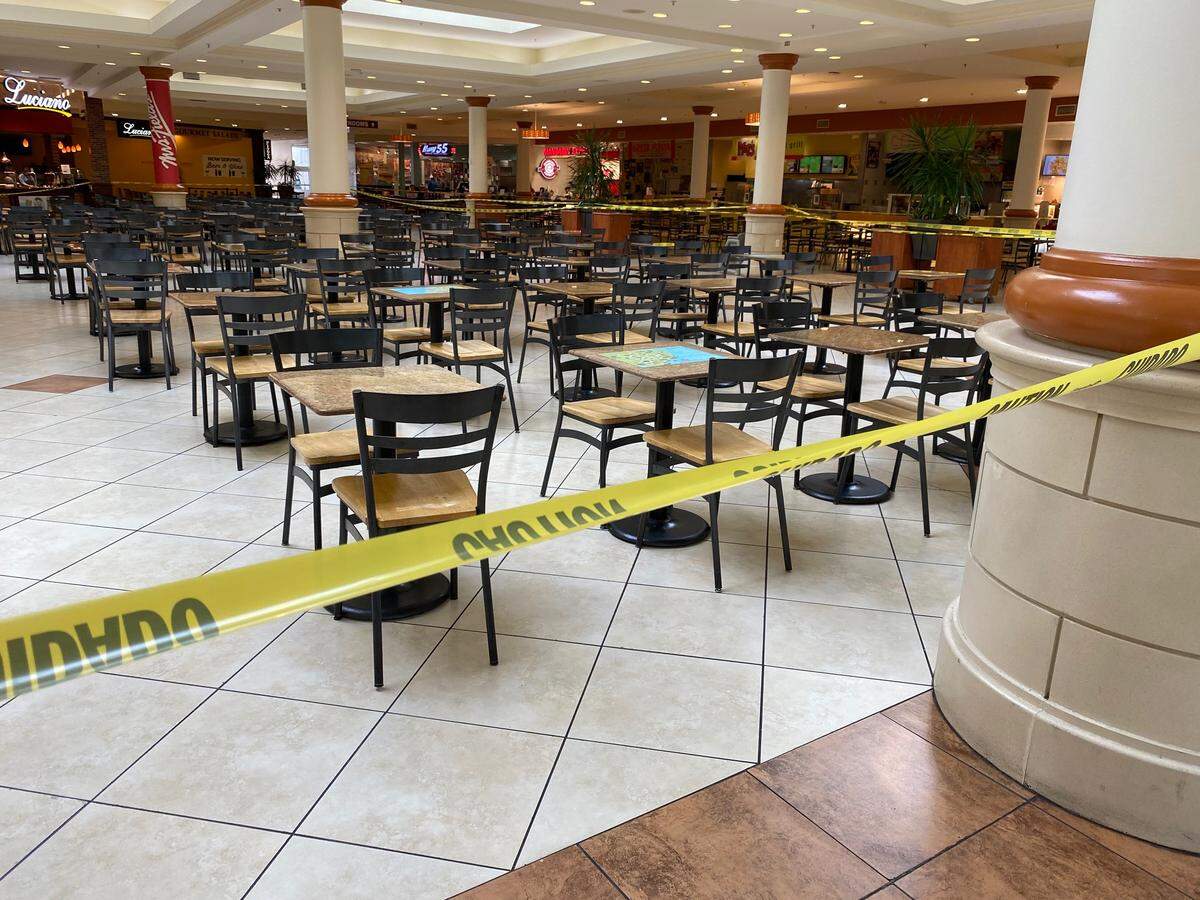 Chairs in the food court at Crabtree Valley Mall are roped off on March 18, 2020, after an executive order from Governor Roy Cooper closes restaurant dining rooms and makes dining spots takeout or delivery only.