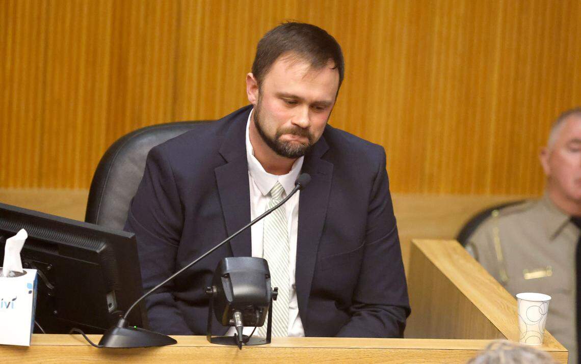 Johnston County school board member Ronald Johnson Jr. answers a question during cross examination during his trial at the Johnston County Courthouse in Smithfield, N.C., Thursday, Jan. 16, 2025. Johnson is on trial on criminal charges of extortion, obstruction of justice and willfully failing to discharge his duties.