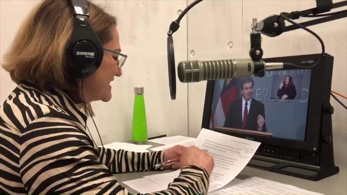As Gov. Roy Cooper speaks, Jackie Metivier simultaneously interprets his words into Spanish for the Department of Public Safety’s Spanish live stream.