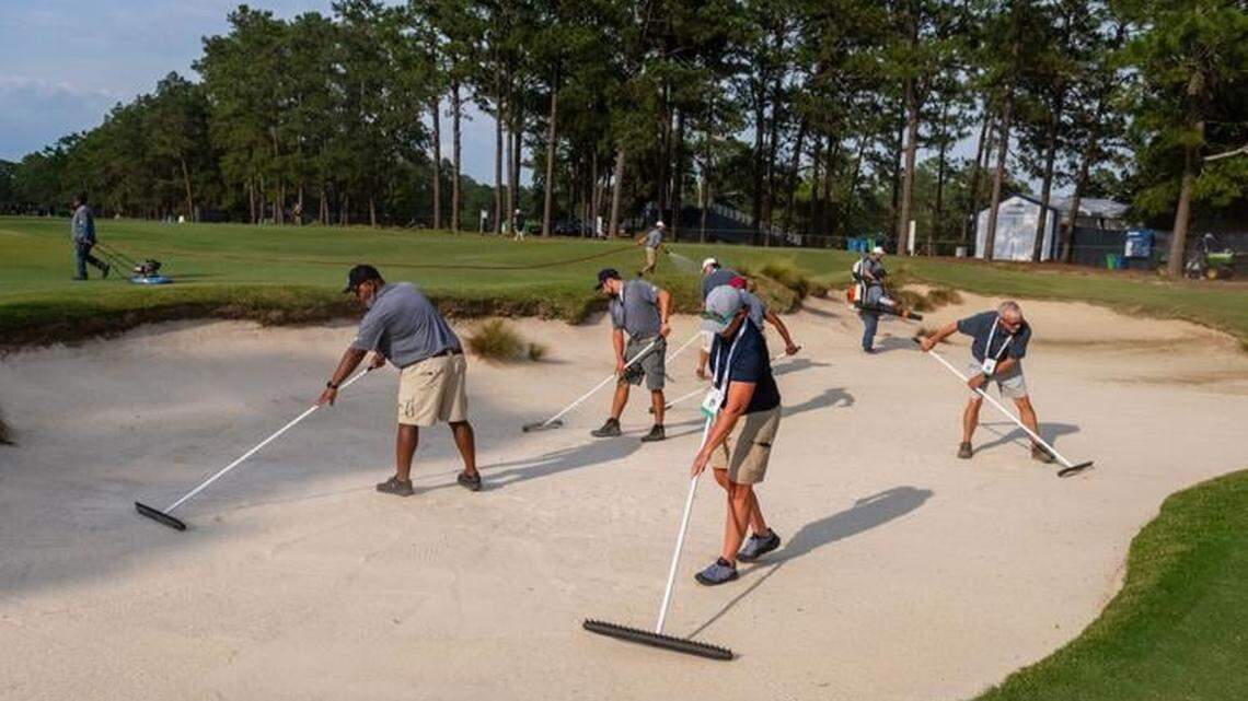 USGA Grounds crews descend on the first hole to prepare the course for the opening round of the 124th U.S. Open on June 12, 2024, at Pinehurst Resort & Country Club (Course No. 2) in Pinehurst, North Carolina.