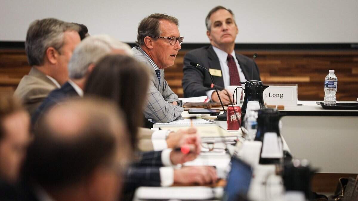 Tom Fetzer, a former Raleigh mayor who at the time was a UNC Board of Governors member, questions the background of the leading contender for chancellor of Western Carolina University at a board meeting in this file photo.