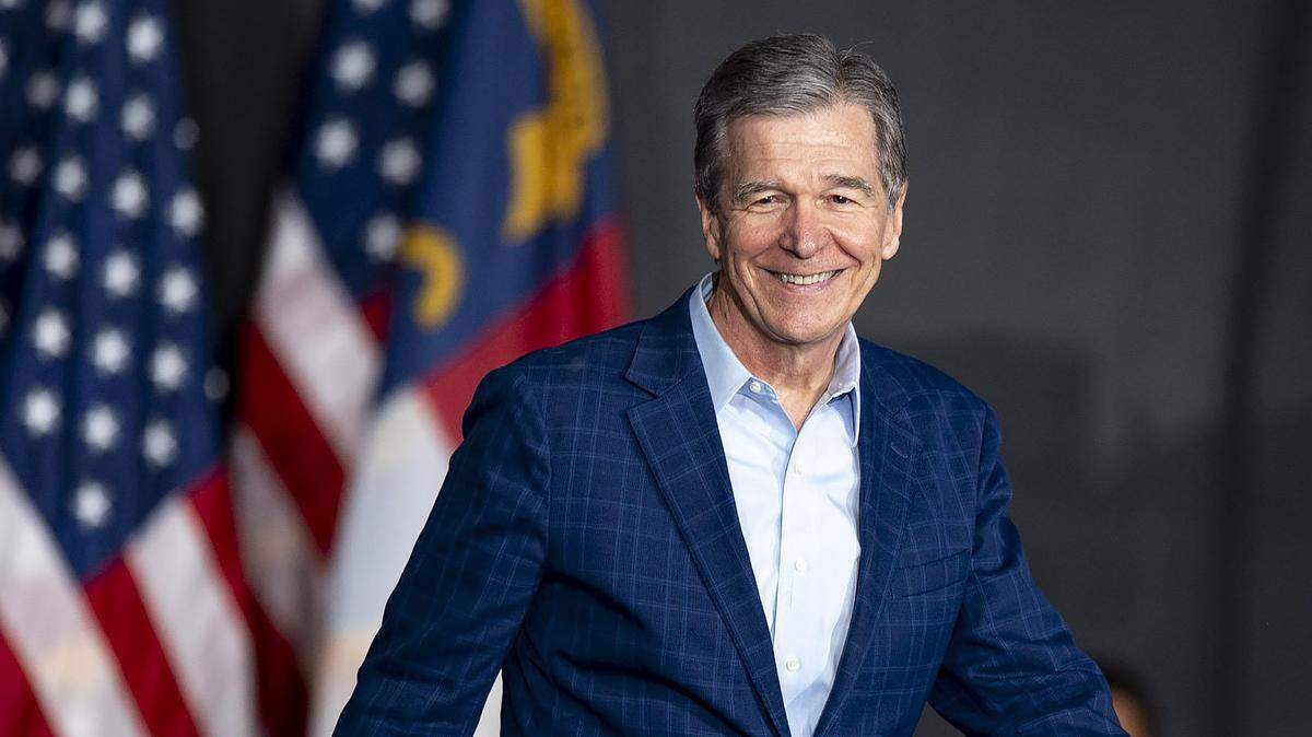 Gov. Roy Cooper takes the stage during a campaign event at the Jim Graham building at the North Carolina State Fairgrounds in Raleigh on Friday June 28, 2024.