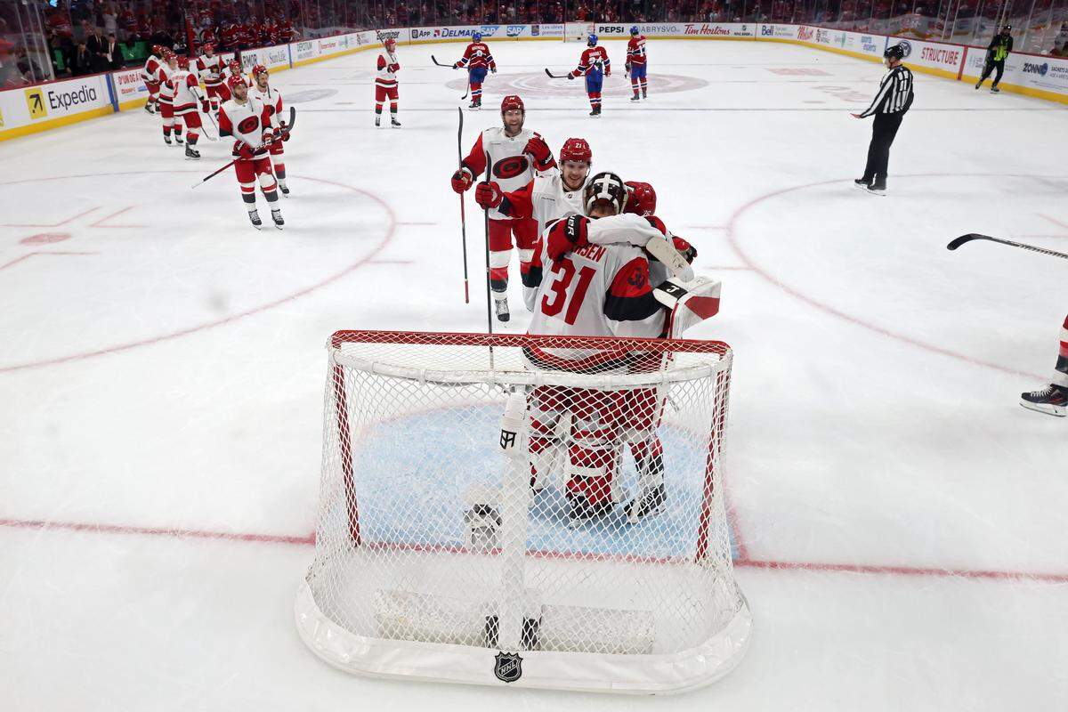 Frederik Andersen #31 of the Carolina Hurricanes is congratulated by teammates after their 4-0 victory against the Montreal Canadiens in Game Four of the Eastern Conference Final of the 2026 Stanley Cup Playoffs at Bell Centre on May 27, 2026 in Montreal, Quebec, Canada.