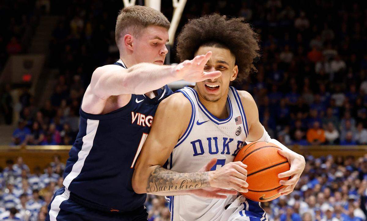 Duke’s Tyrese Proctor (5) drives by Virginia’s Isaac McKneely (11) during the second half of Duke’s 73-48 victory over Virginia at Cameron Indoor Stadium in Durham, N.C., Saturday, March 2, 2024.