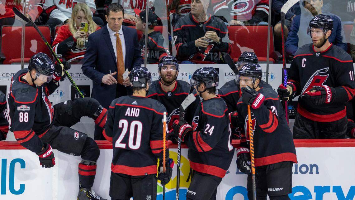 Down 3-0 to the Tampa Bay Lightning, Carolina Hurricanes’ coach Rod Brind’Amour huddles with his team during a time out in the third period on Tuesday, March 28, 2023 at PNC Arena in Raleigh, N.C.