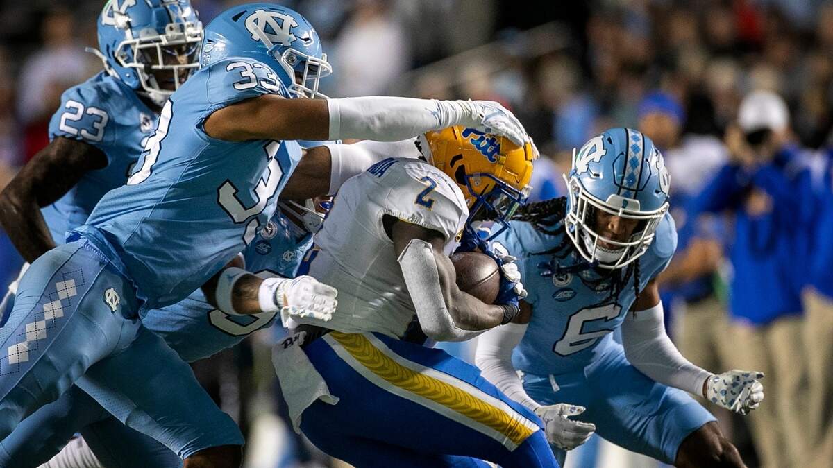 North Carolina linebacker Cedric Gray (33) stops Pitt’s Israel Abanikanda (2) for no gain in the first quarter on Saturday, October 29, 2022 at Kenan Stadium in Chapel Hill, N.C.