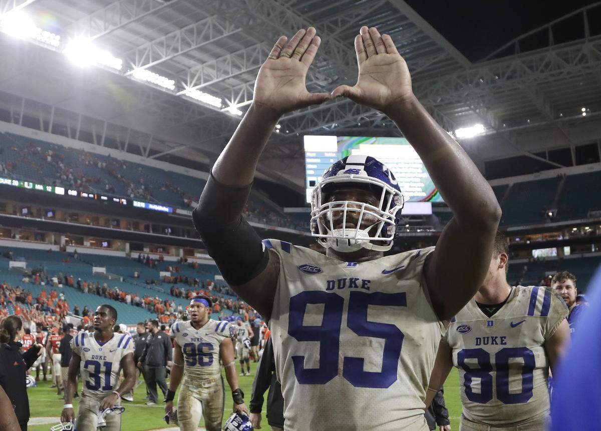 Duke defensive tackle Trevon McSwain (95) does the sign of the “U’” after Duke defeated Miami 20-12.