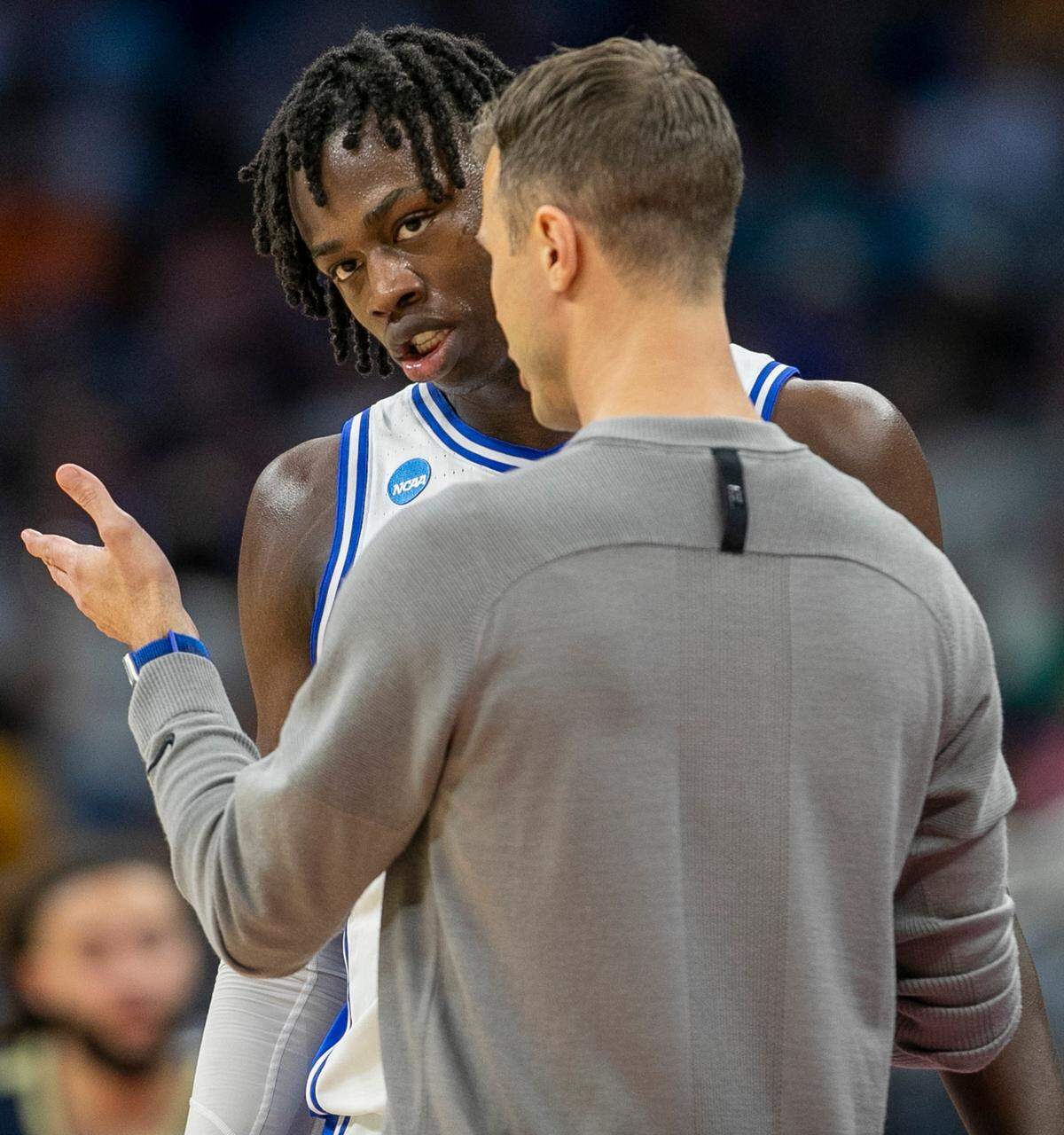 Duke coach Jon Scheyer confers with Mark Mitchell (25) in the second half against Oral Roberts during the first round of the NCAA Tournament on Thursday, March 16, 2023 at the Amway Center in Orlando, Fla.