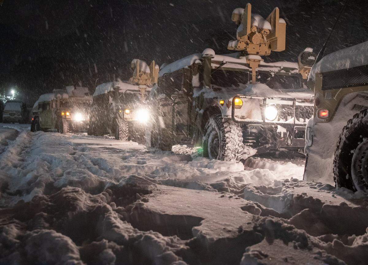 North Carolina National Guard Soldiers assigned to the 211th Military Police Company and the 514th Military Police Company, stage vehicles for vehicle recovery and safety checks for stranded motorists in Farmville, North Carolina on Jan. 31st, 2026. 