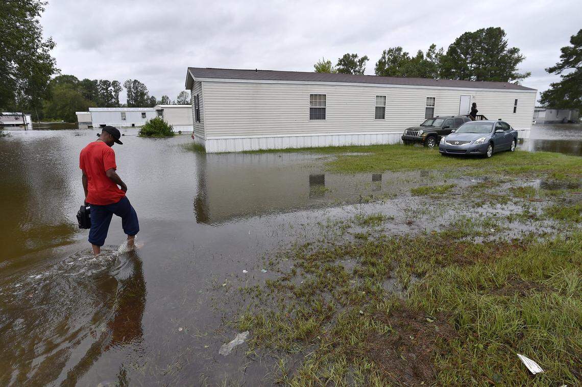 After heavy rains left his home partially flooded in Lumberton, NC, Joseph Singletary returned Sunday morning to gather some items  before trying to find shelter from Tropical Storm Florence.