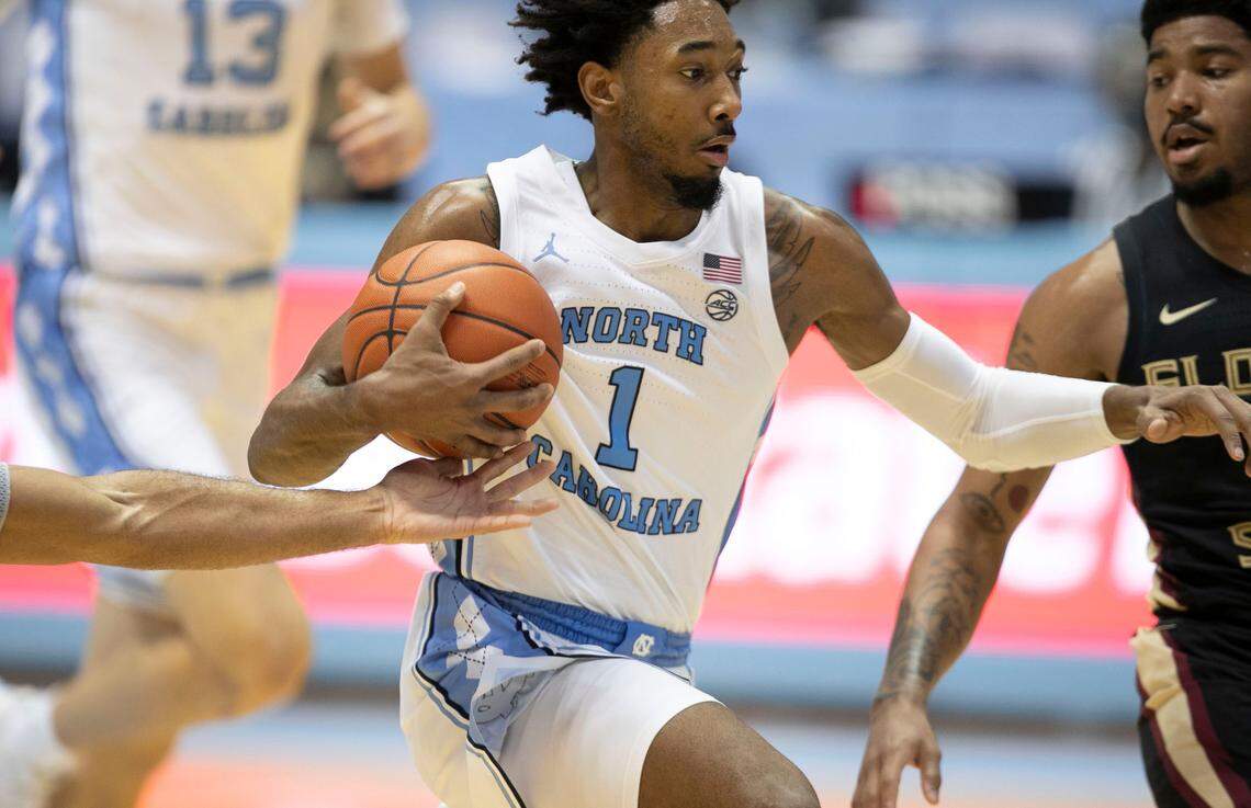 North Carolina’s Leaky Black (1) drives to the basket against Florida State’s Rayquan Evans (0) during the first half on Saturday, February 27, 2021 in Chapel Hill, N.C.