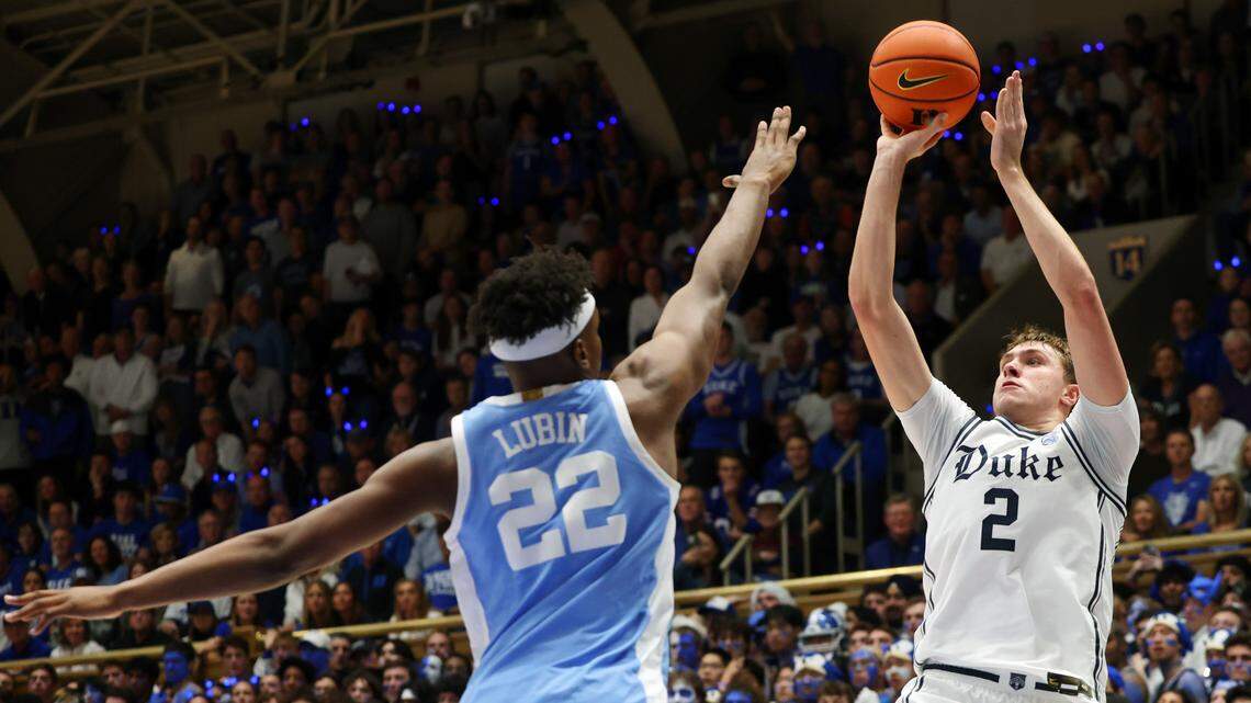 Duke’s Cooper Flagg shoots over UNC’s Ven-Allen Lubin in first half action, Feb. 1, 2025.
