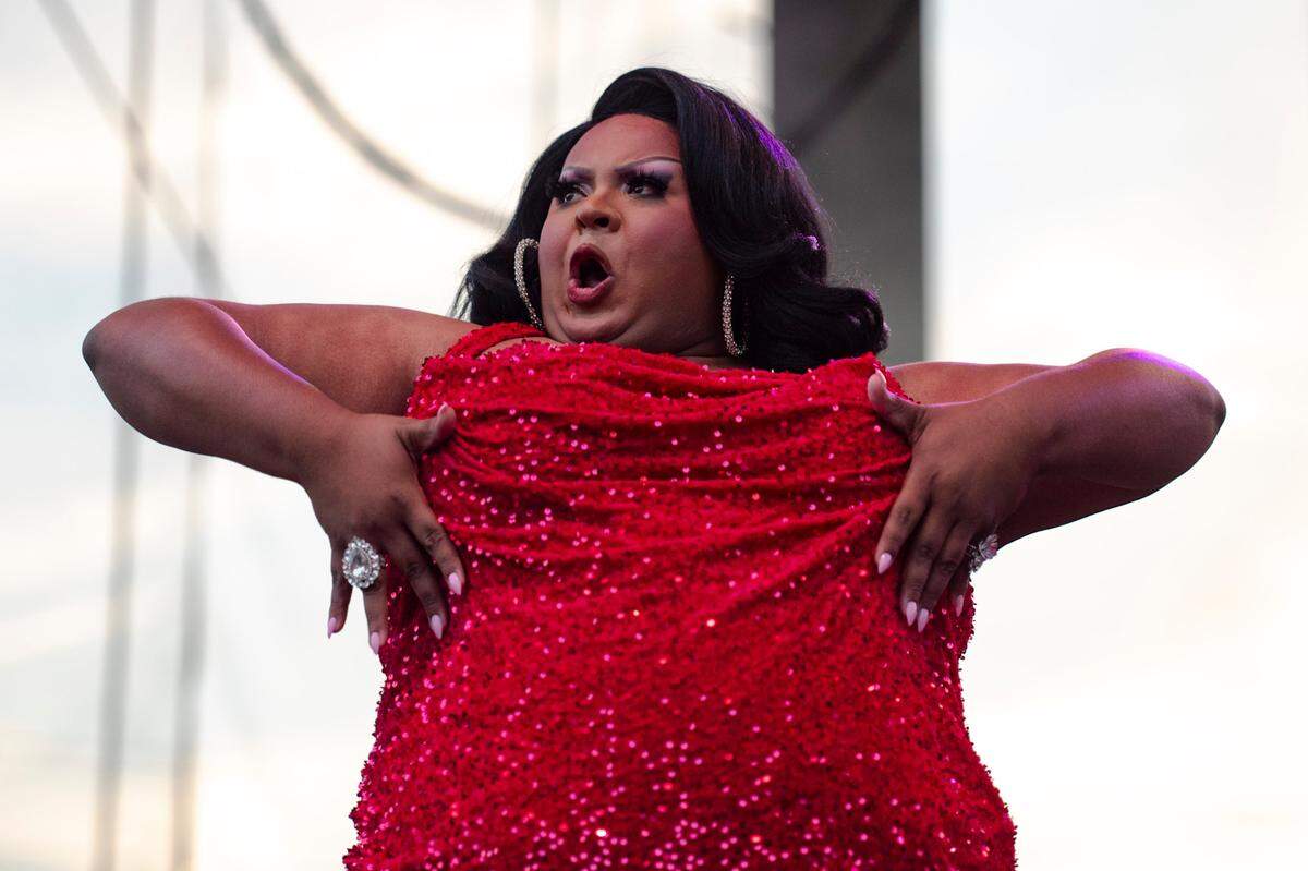 Drag Queen Kiara Mel performs as an opening act for Chappell Roan at Red Hat Amphitheater on Wednesday, June 12, 2024. Mel handmade her dress for the performance after finding out she was selected to be one of the opening queens at the Raleigh show.