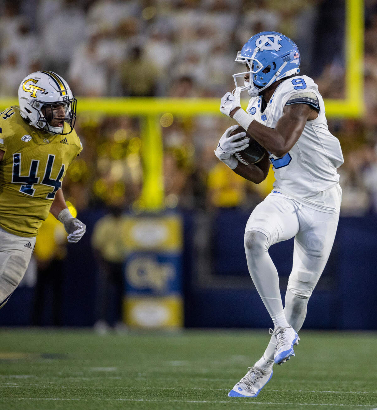 North Carolina’s Devontez Walker (9), looks for running room after a 36-yard pass completion from quarterback Drake Maye with 2:54 to play in the game on Saturday, October 28, 2023 at Bobby Dodd Stadium in Atlanta, Georgia.